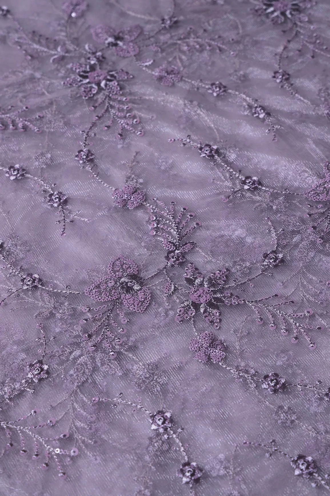 Beautiful Grey Thread With Sequins Floral Embroidery Work On Purple Grey Soft Net Fabric