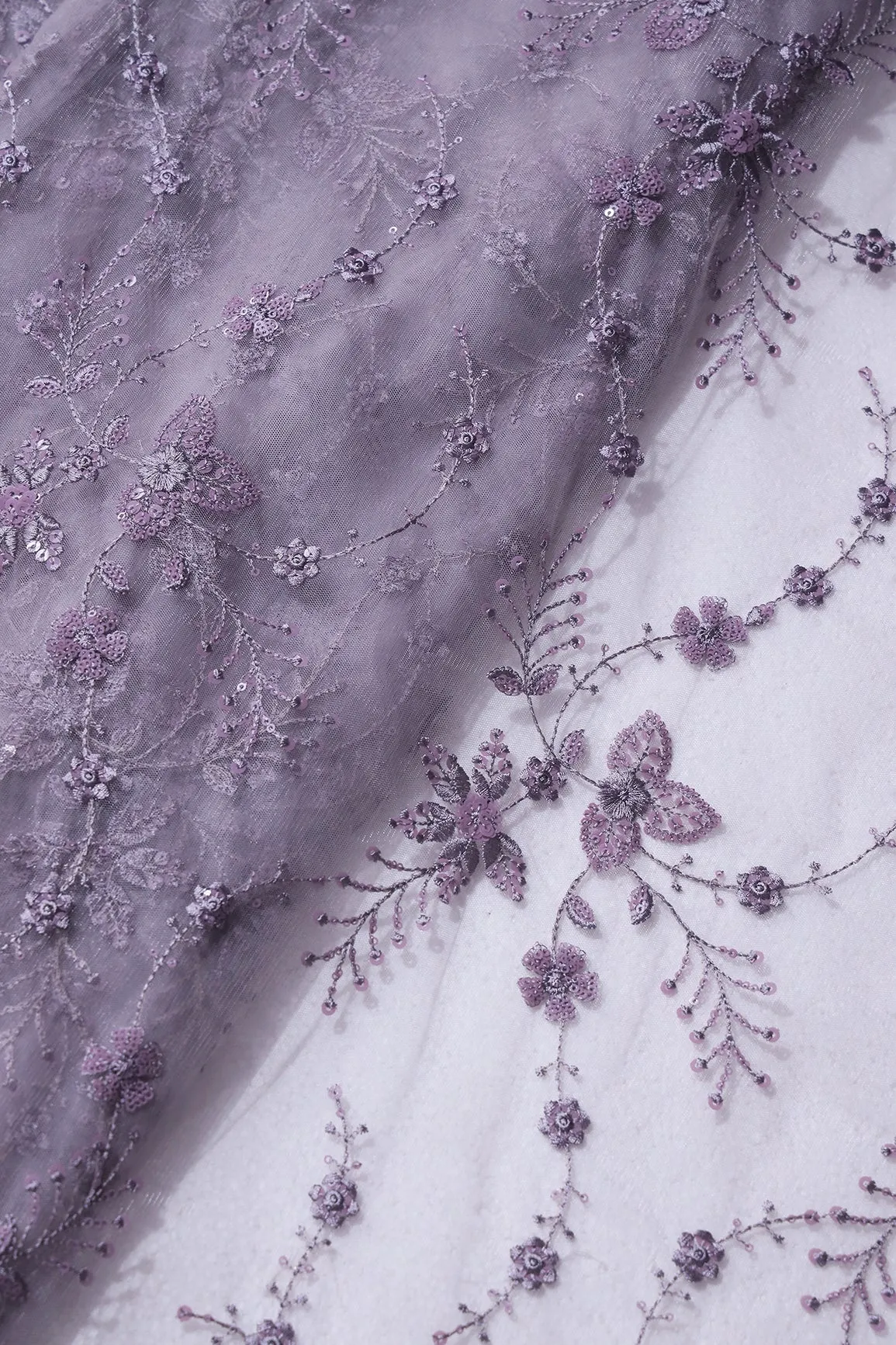 Beautiful Grey Thread With Sequins Floral Embroidery Work On Purple Grey Soft Net Fabric